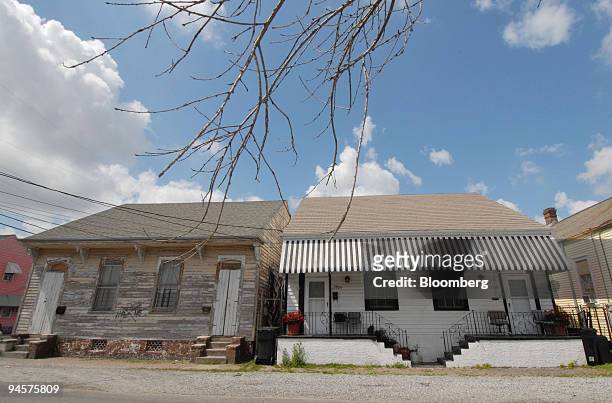 The home of Hattie Warren who struggles to pay the mortgage on her black and white New Orleans home nearly two years after Hurricane Katrina, sits at...