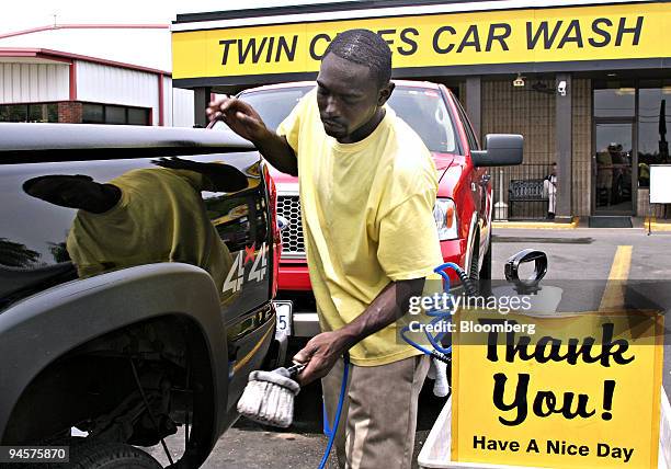 Fred Bryant, a worker at Twin Cities car wash, details a pickup truck in Bossier City, Louisiana, on Monday, July 23, 2007. Bryant, who currently...