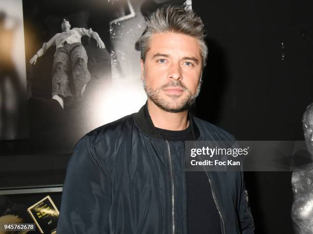 Actor:singer Anthony Dupray attends the Maurice Renoma Serie Noire Exhibition At Renoma Store Rue De La Pompe on April 12, 2018 in Paris, France.