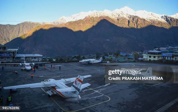Private aircraft are pictured at the Tenzing-Hillary Airport in Lukla, some 140 km northeast of Kathmandu, on April 13, 2018. Lukla is known as the...