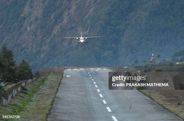 Private aircraft lands at the Tenzing-Hillary Airport in Lukla, some 140 km northeast of Kathmandu, on April 13, 2018. Lukla is known as the gateway...
