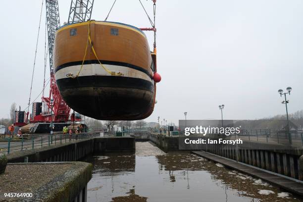 Replica of Captain Cook's famous ship, HM Bark Endeavour, is hoisted by crane over the lock gates on the River Tees barrage as it undergoes...