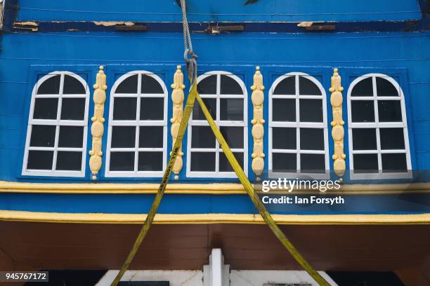 Final preparations are made as a replica of Captain Cook's famous ship, HM Bark Endeavour, is made ready to be hoisted by crane over the lock gates...