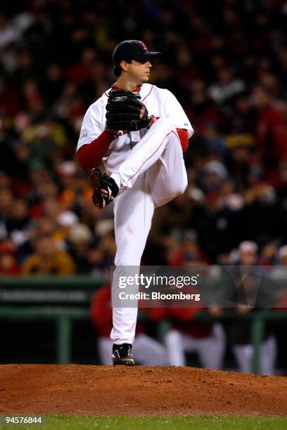 Josh Beckett of the Boston Red Sox pitches against the Colorado Rockies during Game 1 of the Major League Baseball World Series at Fenway Park in...