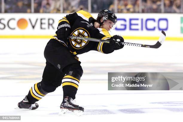 Torey Krug of the Boston Bruins takes a shot on goal during the third period of Game One of the Eastern Conference First Round during the 2018 NHL...