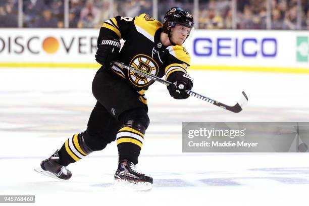 Torey Krug of the Boston Bruins takes a shot on goal during the third period of Game One of the Eastern Conference First Round during the 2018 NHL...