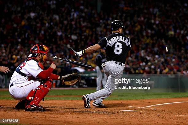 Yorvit Torrealba of the Colorado Rockies breaks his bat while batting against the Boston Red Sox during Game 1 of the Major League Baseball World...