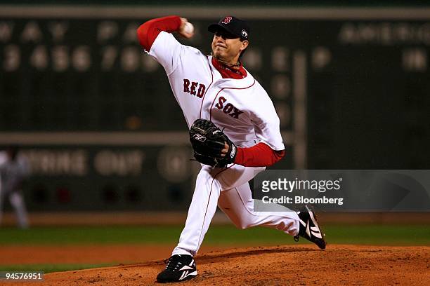 Josh Beckett of the Boston Red Sox pitches against the Colorado Rockies during Game 1 of the Major League Baseball World Series at Fenway Park in...