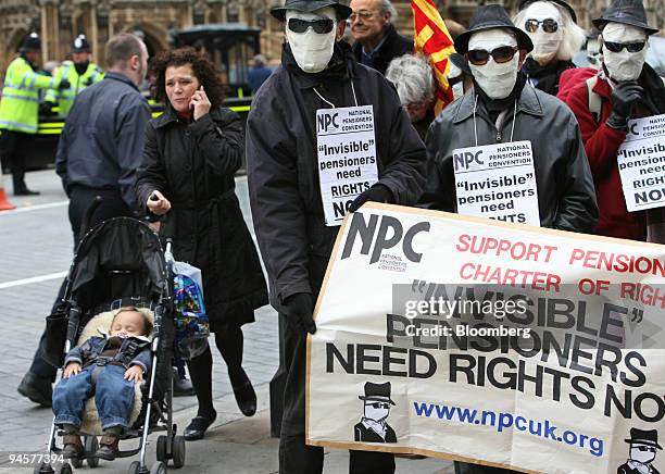 Pensioners, dressed like ''the Invisible Man,'' demonstrate in Parliament Square in London U.K., on Wednesday, Oct. 24, 2007. The pensioners are...