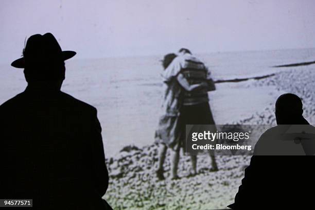 Visitors to the Dali and Film exhibition watch Luis Bunuel and Salvador Dali's 1929 film ''Un Chien andalou'' at Tate Modern in London, U.K.,...