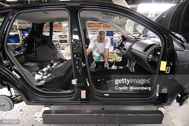 Worker assembles an Audi A3 car on the production line at the Audi factory in Brussels, Belgium, Thursday, May 30, 2007. Audi AG, Volkswagen AG's...