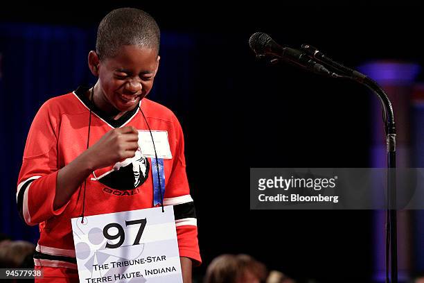 Kennyi Aouad of Terre Haute, Indiana, laughs after hearing his word, "sardoodledom", which he spelled correctly during a preliminary round of the...