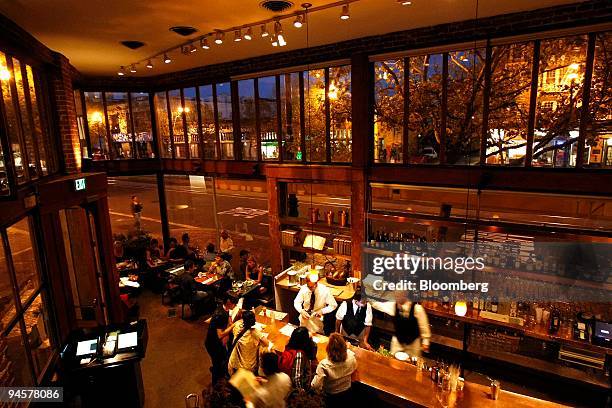 Patrons drink and dine at Zuni Cafe, a restaurant located at 1658 Market Street in San Francisco, California, U.S., on Tuesday, Oct. 23, 2007.