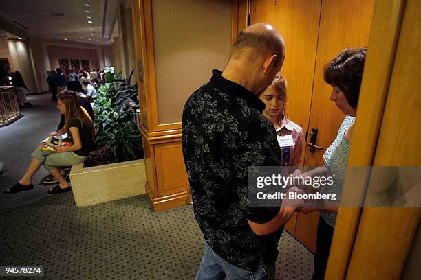 Audrey Hale of Gaines, Michigan, prays with her parents Kelly and Rick before round one of the 2007 Scripps National Spelling Bee, Wednesday, May 30...