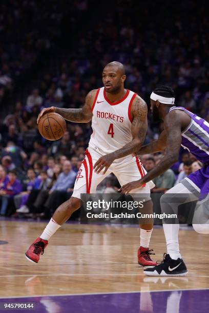 Tucker of the Houston Rockets dribbles the ball JaKarr Sampson of the Sacramento Kings at Golden 1 Center on April 11, 2018 in Sacramento,...