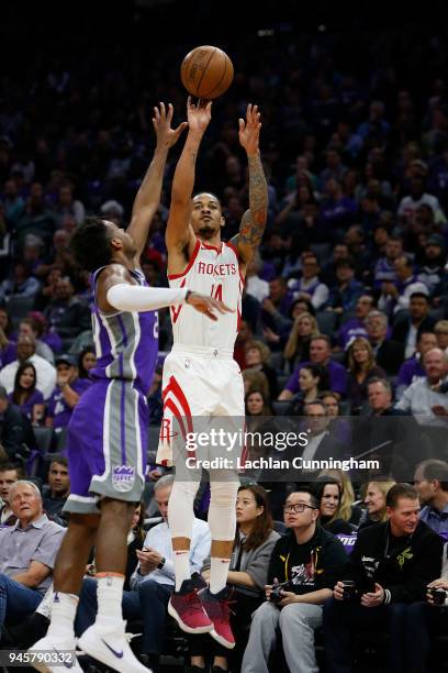 Gerald Green of the Houston Rockets shoots over Buddy Hield of the Sacramento Kings at Golden 1 Center on April 11, 2018 in Sacramento, California....