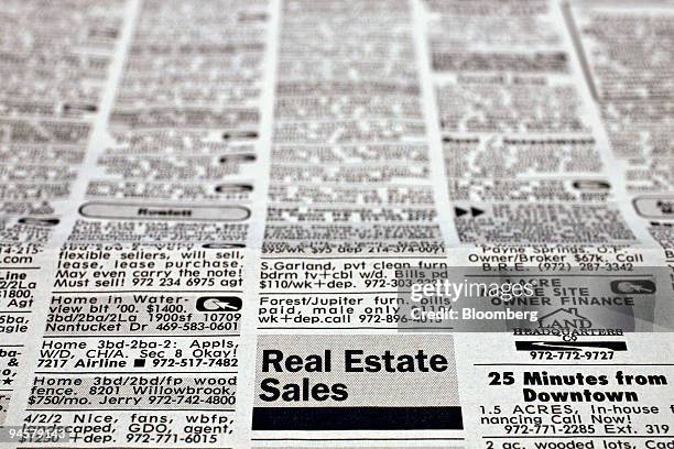 The residential property listings in a copy of the Dallas Morning News is displayed for a photograph in New York, Wednesday, July 18, 2007. A 14...