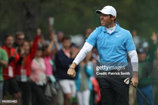 Rory McIlroy of Northern Ireland celebrates making eagle on the eighth hole during the third round of the 2018 Masters Tournament at Augusta National...