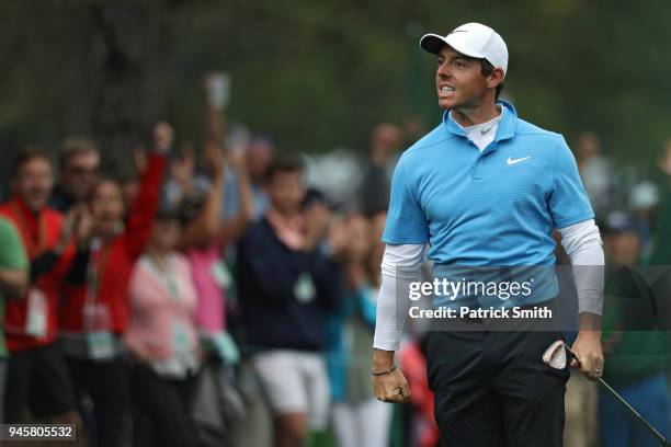 Rory McIlroy of Northern Ireland celebrates making eagle on the eighth hole during the third round of the 2018 Masters Tournament at Augusta National...