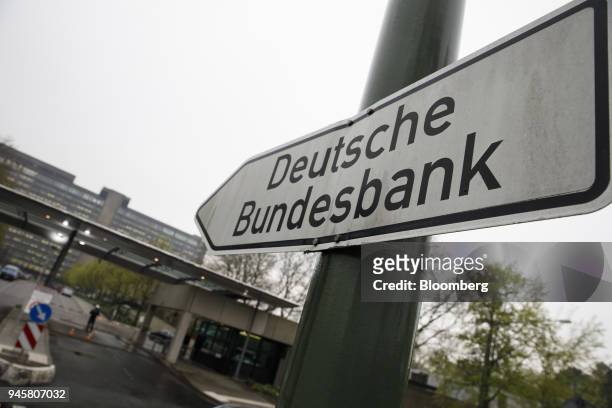 Sign points towards the Deutsche Bundesbank headquarters in Frankfurt, Germany, on Friday, April 13, 2018. Money is piling into the precious metal,...