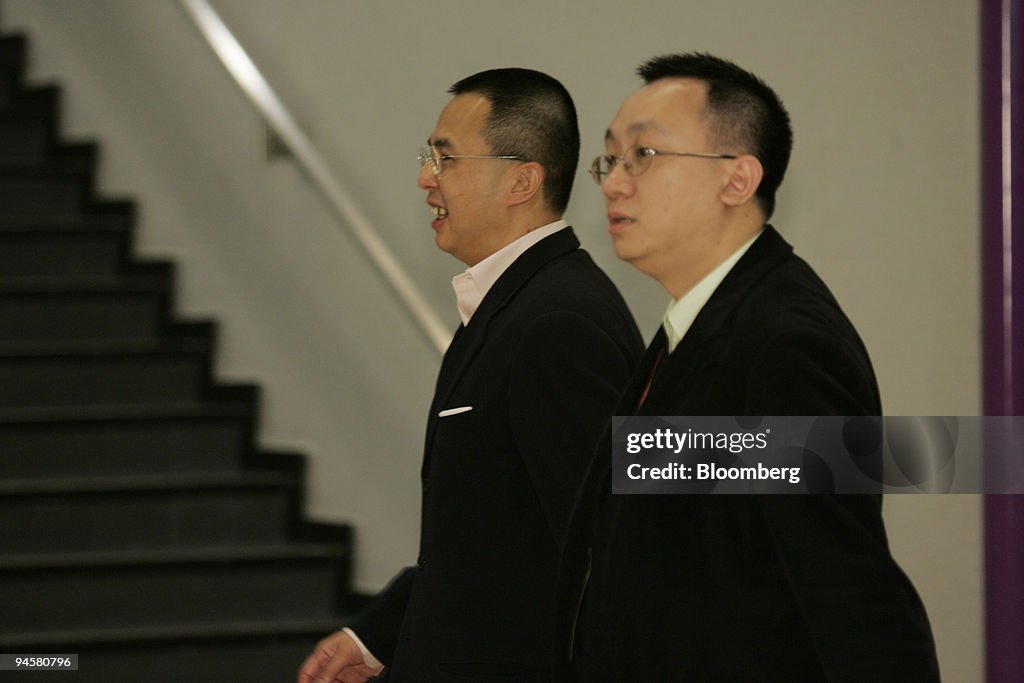 Richard Li, chairman of PCCW Ltd., left, arrives at AsiaWorl