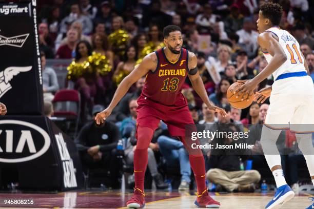 Tristan Thompson of the Cleveland Cavaliers puts pressure on Frank Ntilikina of the New York Knicks during the second half at Quicken Loans Arena on...