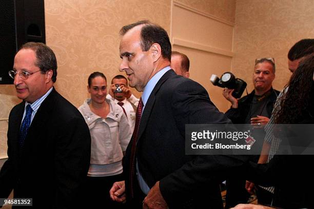 Joe Torre, center, former manager of the New York Yankees, leaves following a news conference in Rye Brook, New York, U.S., on Friday, Oct. 19, 2007....