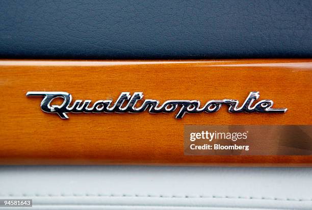The logo of a Maserati Quattroporte automobile is seen on the passenger side console as the car is test driven in Modena, Italy, Tuesday, March 20,...