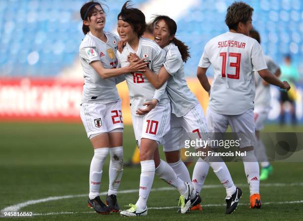 Mizuho Sakaguchi of Japan celebrates with Risa Shimizu and Emi Nakajima scoring the opening goal during the AFC Women's Asian Cup Group B match...