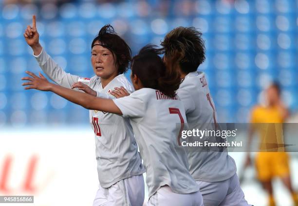 Mizuho Sakaguchi of Japan celebrates scoring the opening goal during the AFC Women's Asian Cup Group B match between Japan and Australia at the Amman...