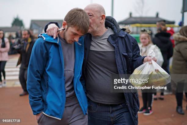 Tom Evans, the father of terminally ill 23-month-old Alfie Evans, is embraced by a supporter after speaking to the media outside Alder Hey Hospital...