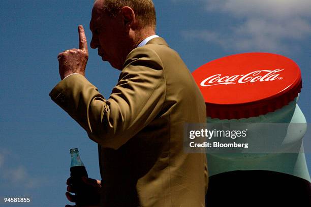 Neville Isdell, Coca-Cola Co. Chairman and chief executive officer, makes remarks on stage at Coca-Cola's Happiness Celebration held to commemorate...