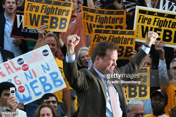 Virginia Senator Elect James Webb waves his fists in celebration as he arrives to speak at a victory rally in Arlington, Virginia, Thursday, November...