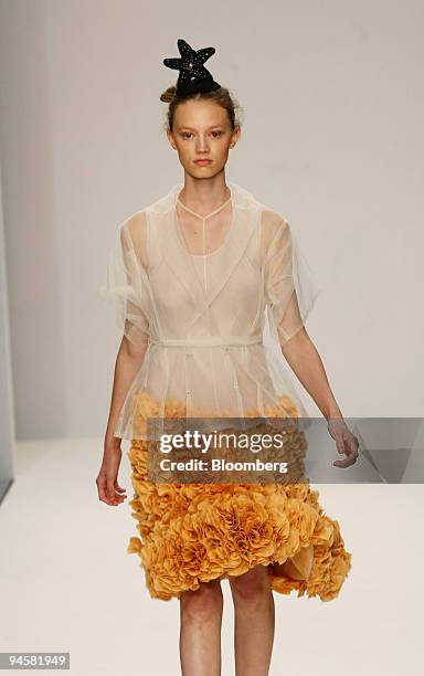 Model wears a blouse and skirt as she walks down the catwalk during the John Rocha fashion show in London, U.K., on Monday, Sept. 17, 2007. British...