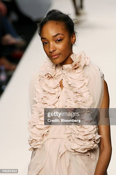 Model wears a blouse and skirt as she walks down the catwalk during the John Rocha fashion show in London, U.K., on Monday, Sept. 17, 2007. British...