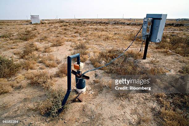 Pipe leads into a production well at the Eastern Mynkuduk uranium mine outside Kyzemshek, Kazakhstan, on Thursday, Oct. 18, 2007. Uranium is mined...