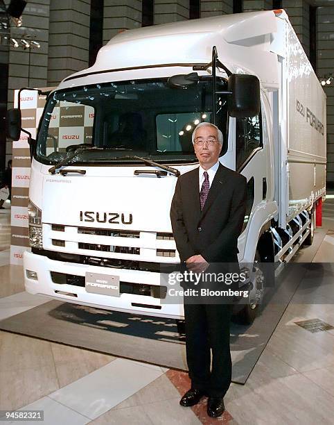 Yoshinori Ida, president of Isuzu Motors Ltd., poses with a Forward mid-duty truck at a news conference in Tokyo, Japan, on Thursday, May 24, 2007....