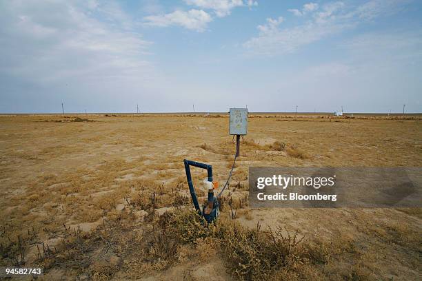 Pipe leads into a production well at the Eastern Mynkuduk uranium mine outside Kyzemshek, Kazakhstan, on Thursday, Oct. 18, 2007. Uranium is mined...