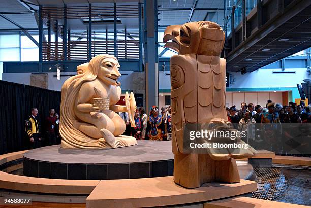 Sculptures of the "Frog Woman" and "Raven" by Tahltan Tlinglit artist Dempsey Bob are on display in the new International Terminal of Vancouver...