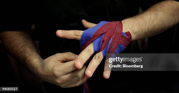 Fighter prepares for training at the Cityboxer gym, in Southwark, south London, Wednesday, November 17, 2006. ``White-collar boxing'' has become so...