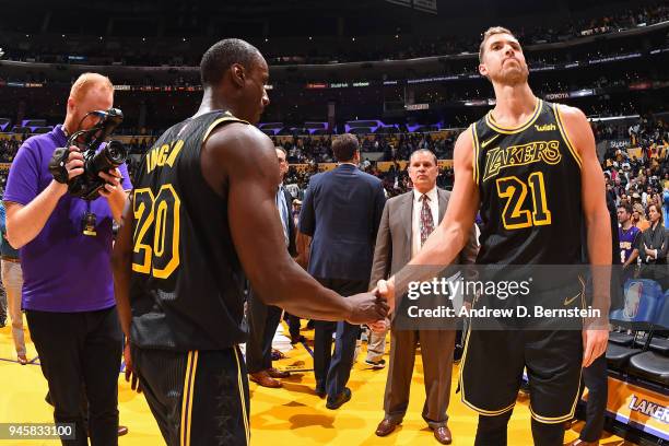 Andre Ingram of the Los Angeles Lakers and Tyler Zeller of the Los Angeles Lakers shake hands after the game against the Houston Rockets on April 10,...