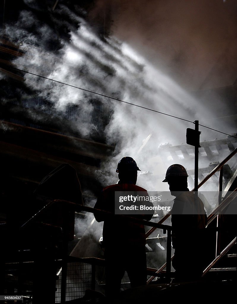 Workers are seen at The Condong Sugarcane Harvesting mill, i