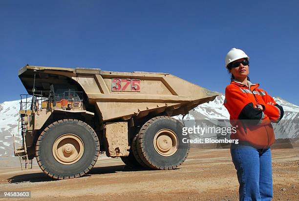 Patricia Guajardo stands near the mining truck she drives at Barrick Gold Corp.'s Veladero mine in the San Juan province of Argentina, on Tuesday,...