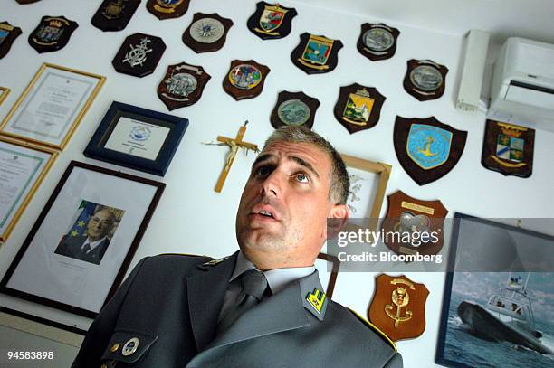 Captain Alessandro Furn? of the Guardia di Finanza poses in his office at Salerno, Italy, on Friday, Sept. 14, 2007. The villas and hotels along the...