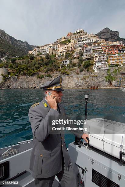 Captain Alessandro Furn? of the Guardia di Finanza police, looks for illegal building along the Amalfi coast, Italy, on Friday, Sept. 14, 2007. The...