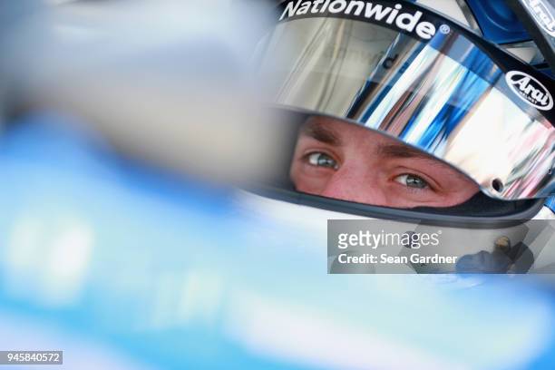 Alex Bowman, driver of the Nationwide Chevrolet, sits in his car during practice for the Monster Energy NASCAR Cup Series Food City 500 at Bristol...