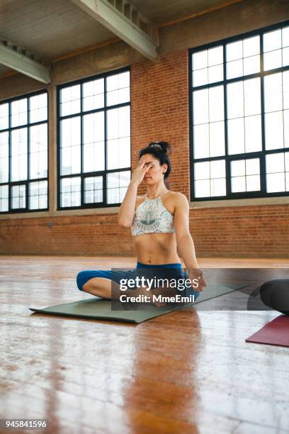 pranayama breathing exercises. woman practicing yoga position - pranayama stock pictures, royalty-free photos & images