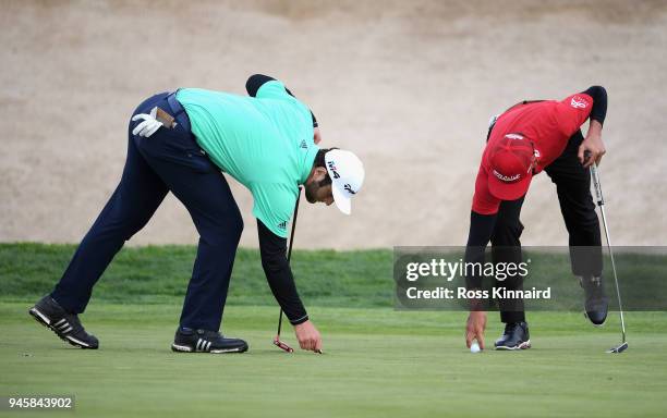 Rafa Cabrera-Bello of Spain and Jon Rahm of Spain on the 18th green during day two of the Open de Espana at Centro Nacional de Golf on April 13, 2018...