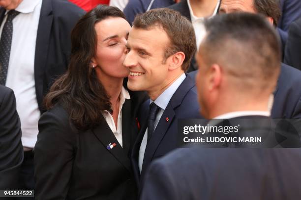 French alpine skier and Paralympic Champion Marie Bochet kisses French President Emmanuel Macron after being awarded Officier of the Legion of Honour...