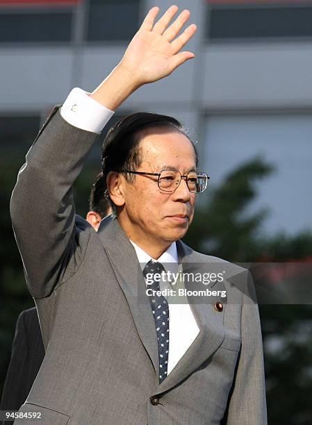 Yasuo Fukuda, former chief cabinet secretary of Japan, waves during an election campaign for the leader of the Liberal Democratic Party in Tokyo,...